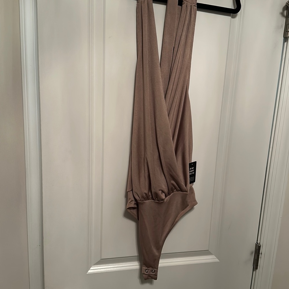 Champagne hold her body suit